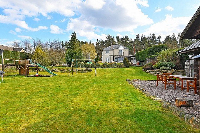 Four bedroom detached house with stables, paddock and field.
